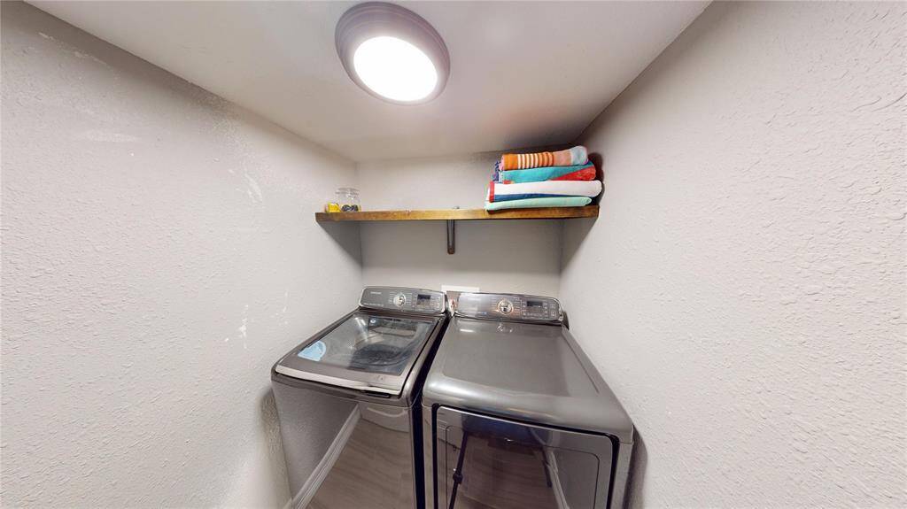 Laundry room washer and dryer convey with home. Located on the lower level.