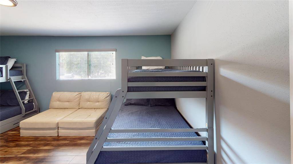 Lower bedroom with large space and plenty of natural light.