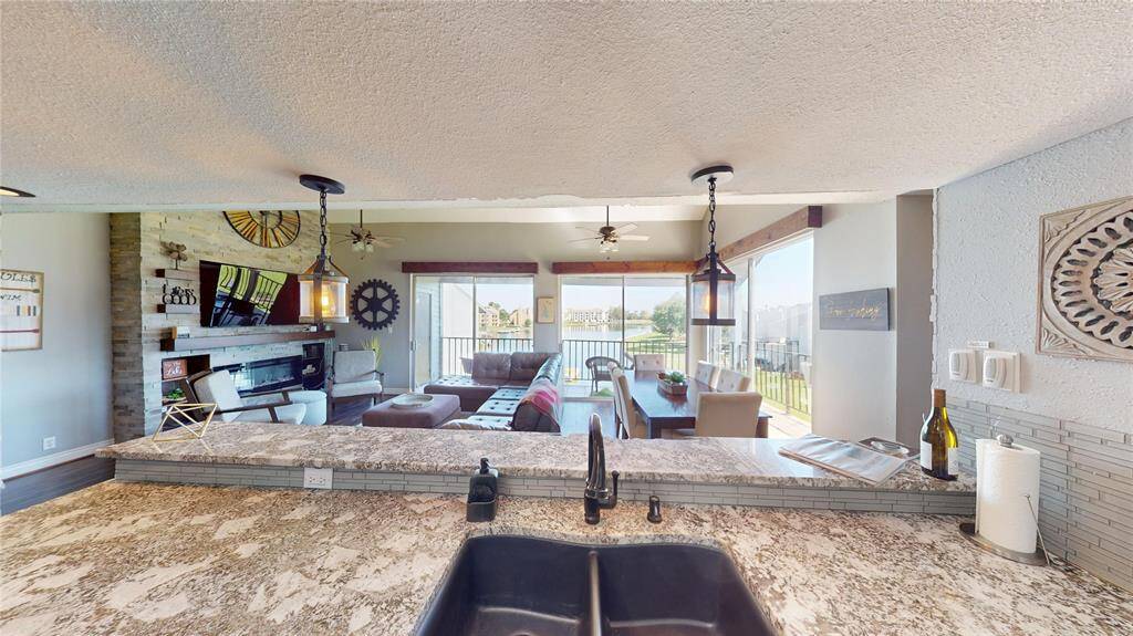 View from your kitchen looking out to the water through the main living space.