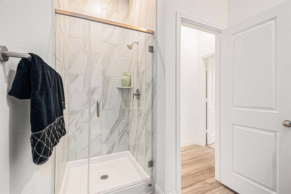 Beautiful marbled shower in secondary bath