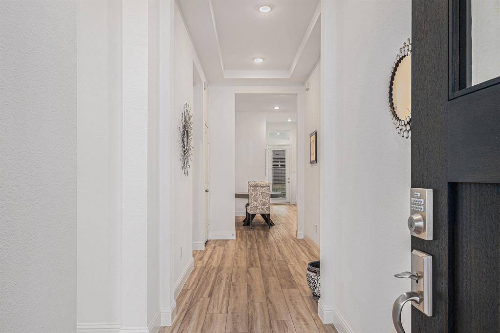 Beautiful naturally lit entry with high ceilings/mud area