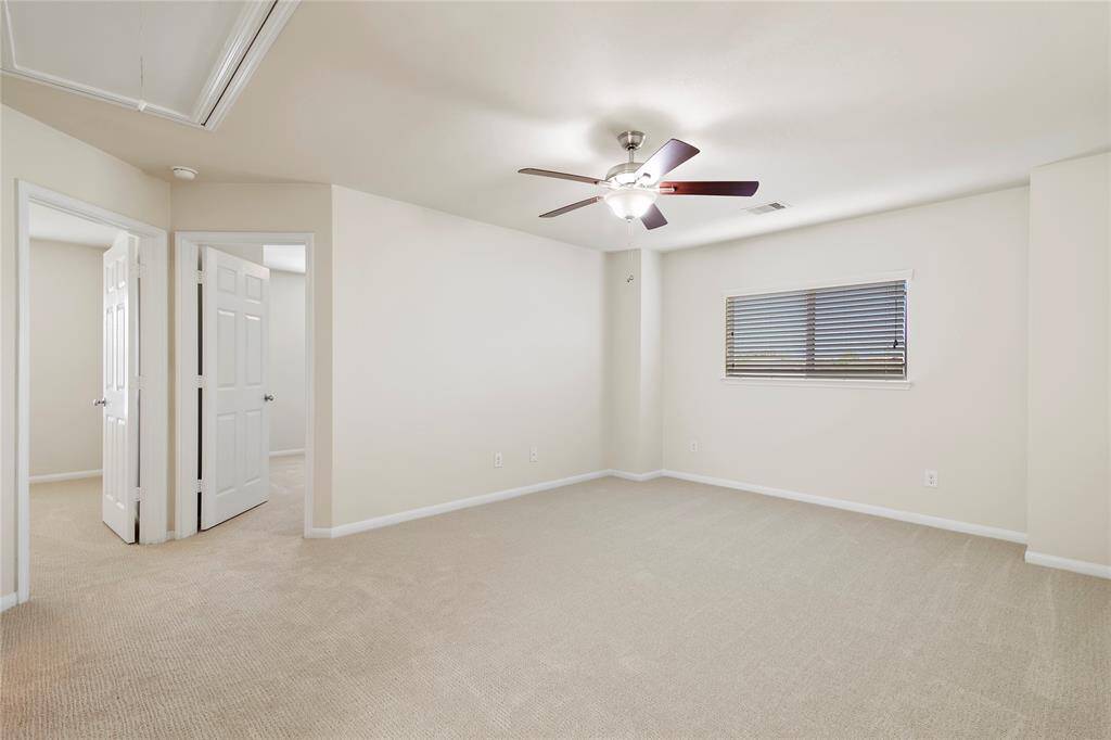 The game room has new carpet, ceiling fan and storage for your favorite games.