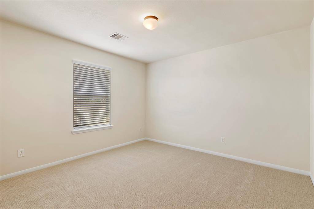 Enjoy the fresh feel of brand-new carpet in the secondary bedroom.