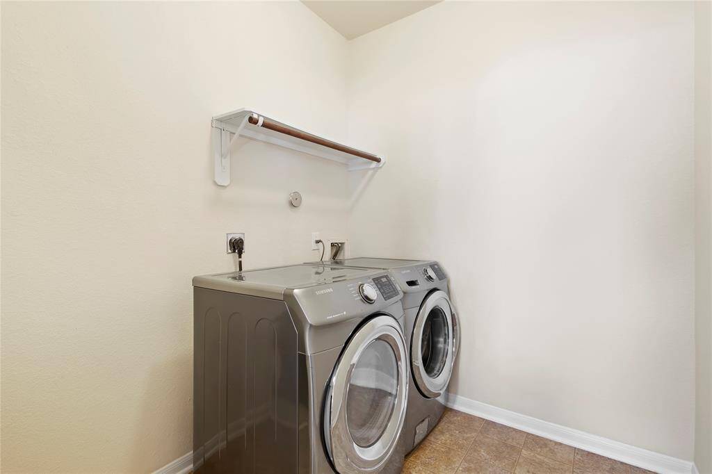 Modern washer and dryer set included for your convenience.