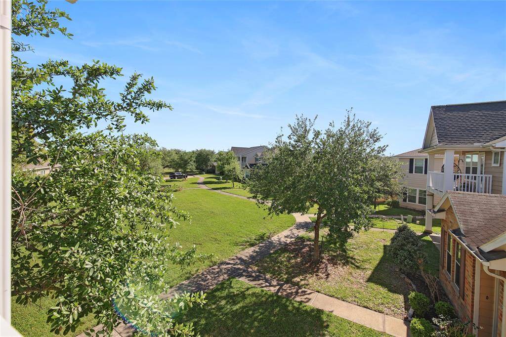 Enjoy serene green space views from your bedroom balcony.
