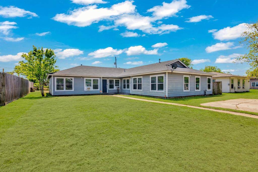 Charming home with a spacious front yard, perfect for family gatherings and outdoor activities.