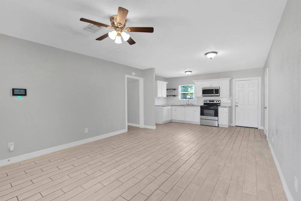 Spacious open-concept kitchen and living area, perfect for modern living and entertaining.