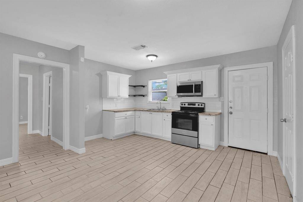 Modern kitchen featuring sleek granite countertops.
