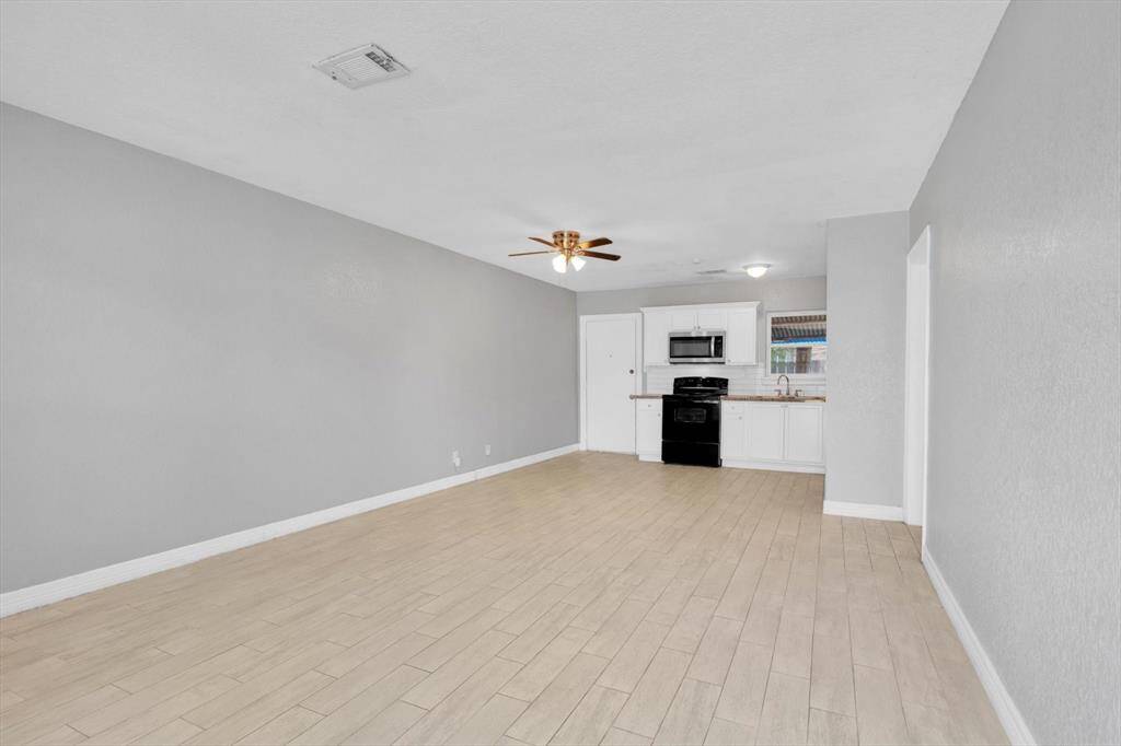 Modern open-concept kitchen seamlessly integrates with the living space, perfect for entertaining and everyday comfort.