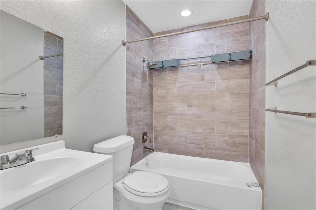 Modern bathroom featuring sleek fixtures, a stylish vanity, and elegant tilework for a touch of luxury.