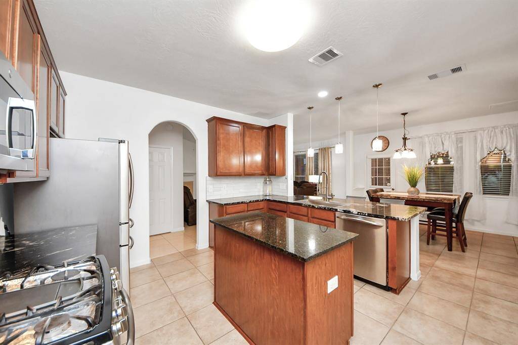 The breakfast bar serves as a convenient place to enjoy your morning or evening meals.