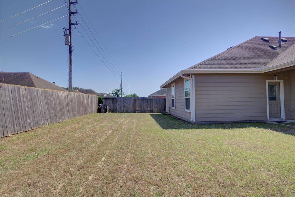 Nice backyard with covered patio and BBQ