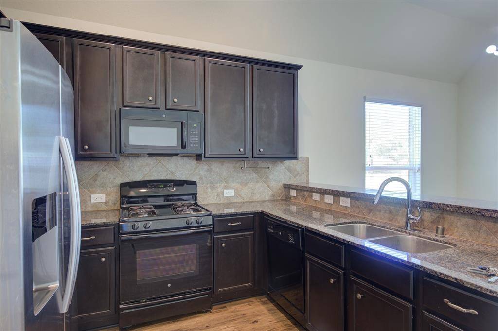 Spacious kitchen with granite countertops