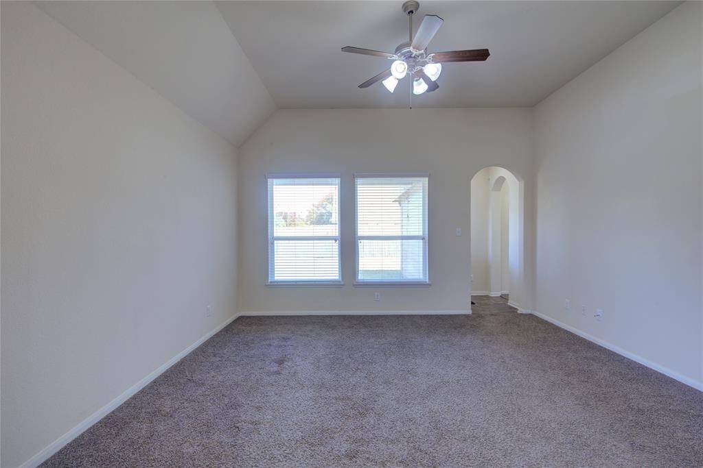 Spacious living with ceiling fan.