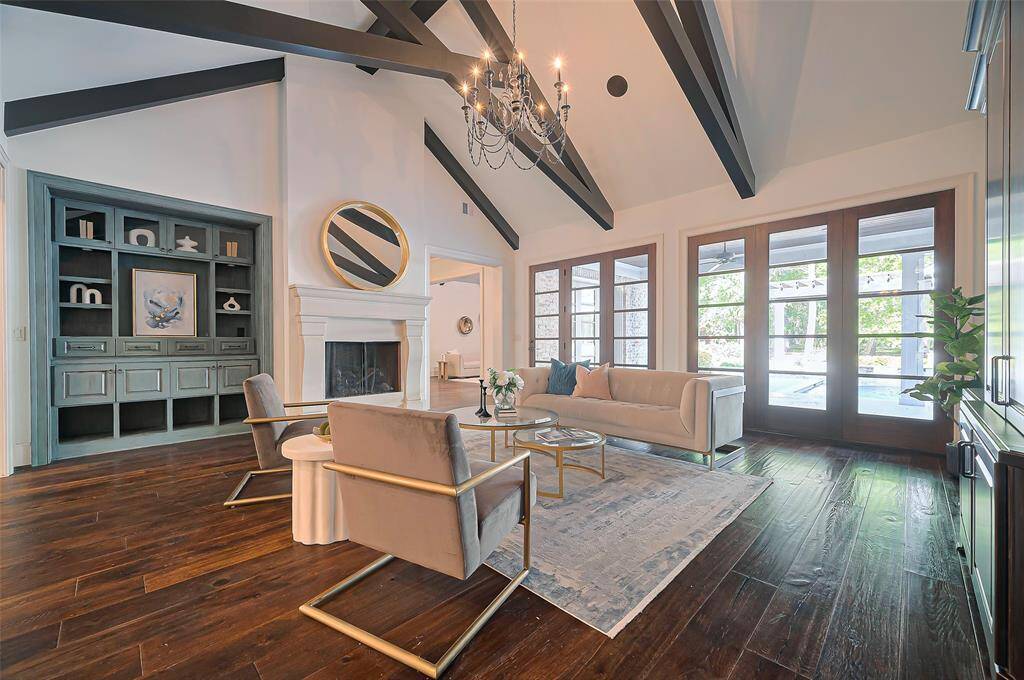 Large windows and glass doors offer ample natural light and views and access to the pool area. Imagine decorating for holidays with family and friends.