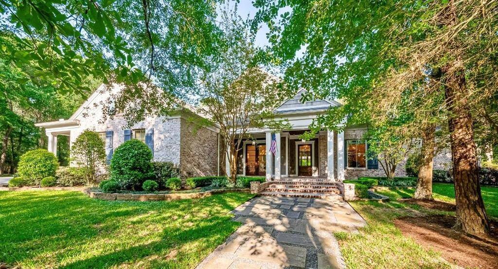 This one of a kind home features historic South Carolina brick with Gorgeous German Schmear Finish with charming columns and a covered porch. The beautifully landscaped front yard adds curb appeal, and large windows provide ample natural light.