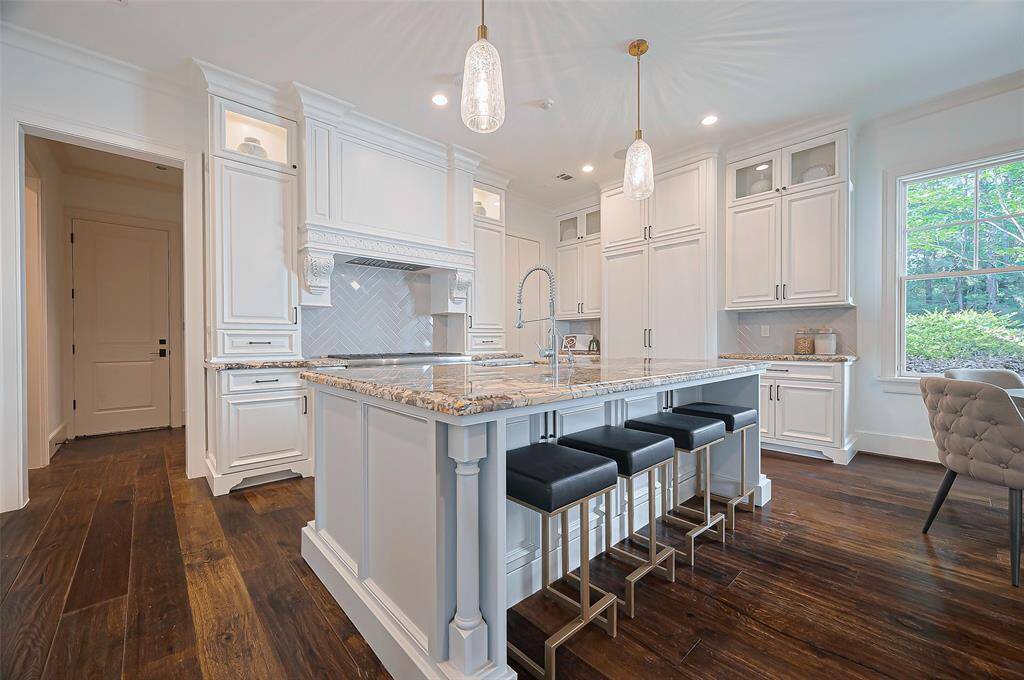 Spacious kitchen is always the heart of any home. Natural light from the windows creates a warm, inviting atmosphere.