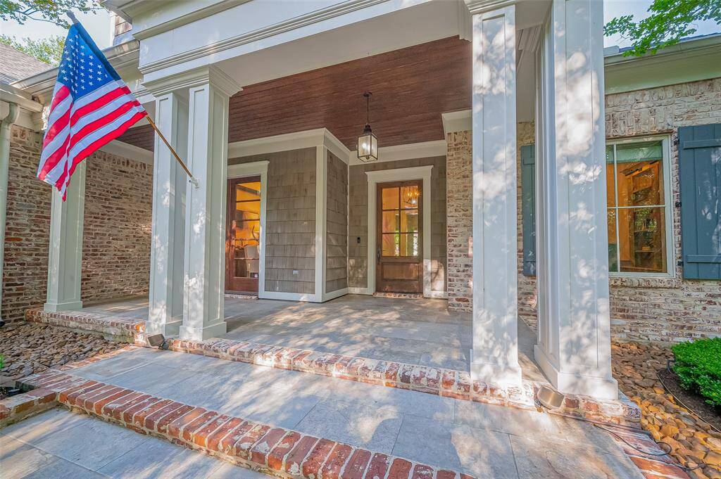 Bring the rocking chairs and enjoy your very own peace of heaven on this lovely front porch.