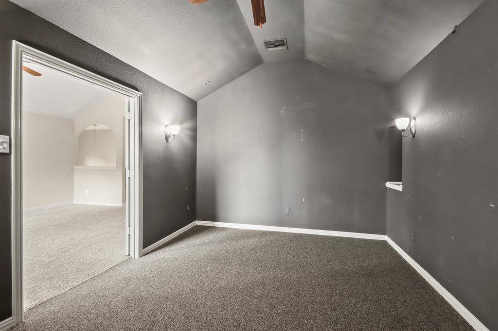 Cozy, dark media room, perfect for an immersive movie-watching experience.
