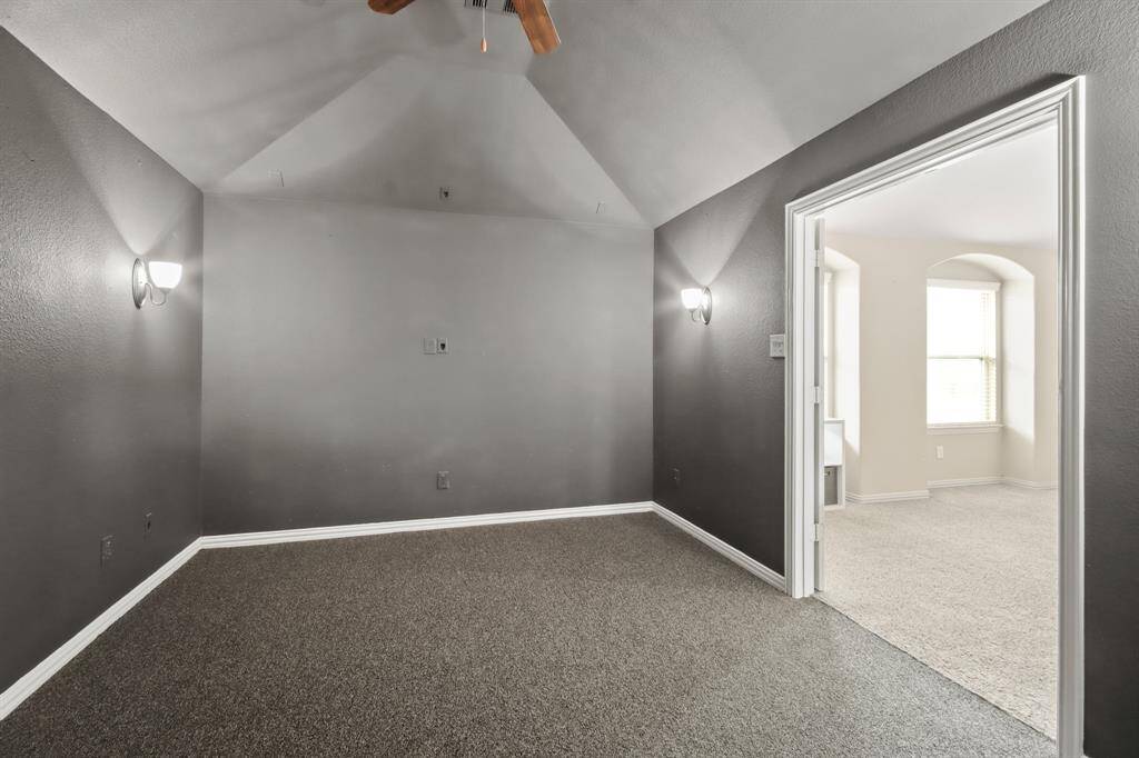 Cozy, dark media room, perfect for an immersive movie-watching experience.