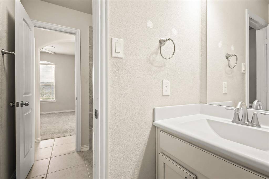 Upstairs bedrooms connected by a convenient Jack and Jill bathroom, offering privacy and shared accessibility. Each bedroom provides ample space, natural light, and cozy comfort.