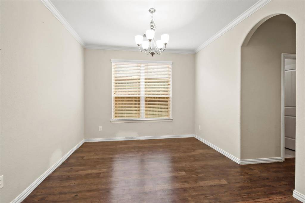 Elegant formal dining room adjacent to the kitchen, perfect for gatherings and entertaining.