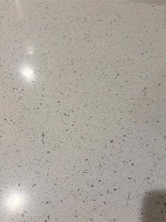 Close view of the solid surface counter tops- light bright and clean look will go with any decor-