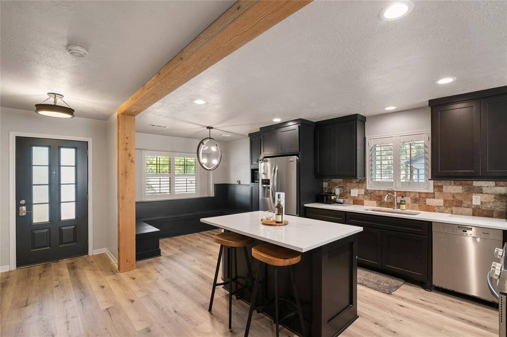 There is ample area in this kitchen complete with this great island-