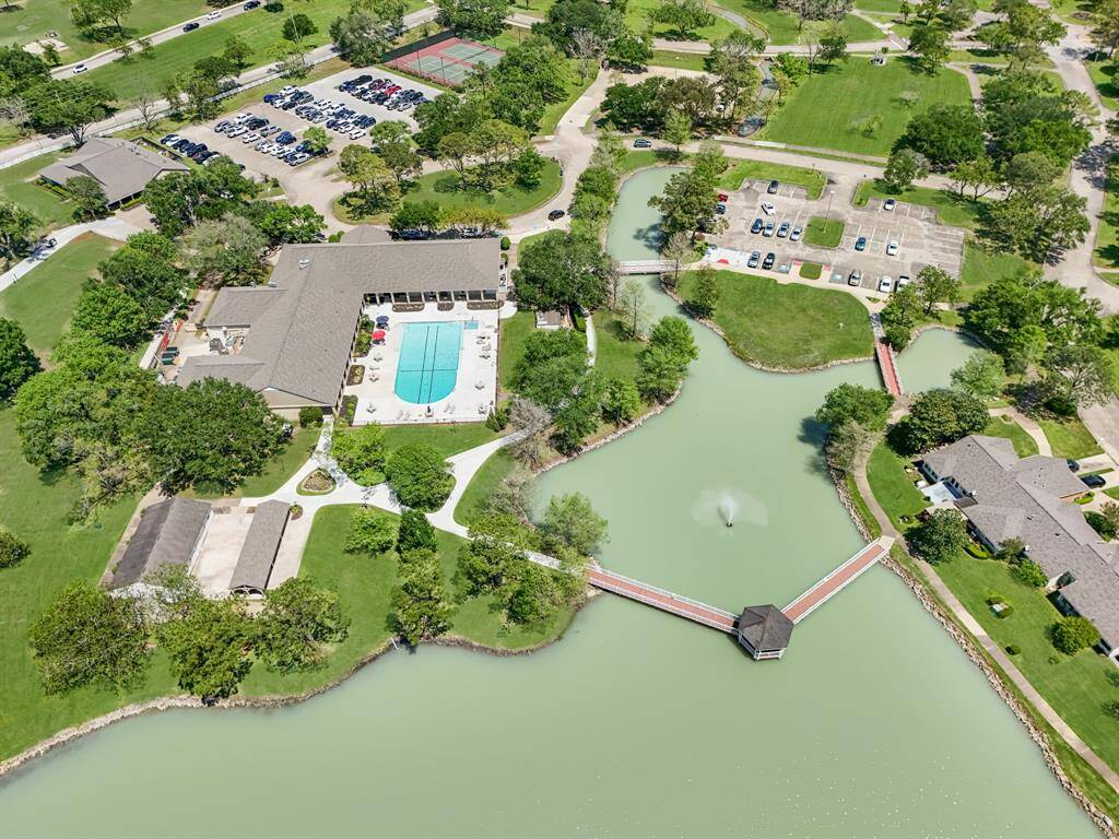 Aerial of clubhouse & community lake.