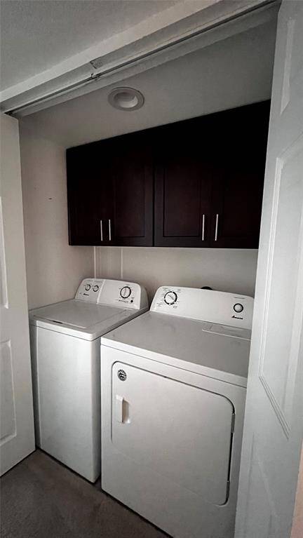Convenient in-unit laundry area with modern appliances and ample storage.
