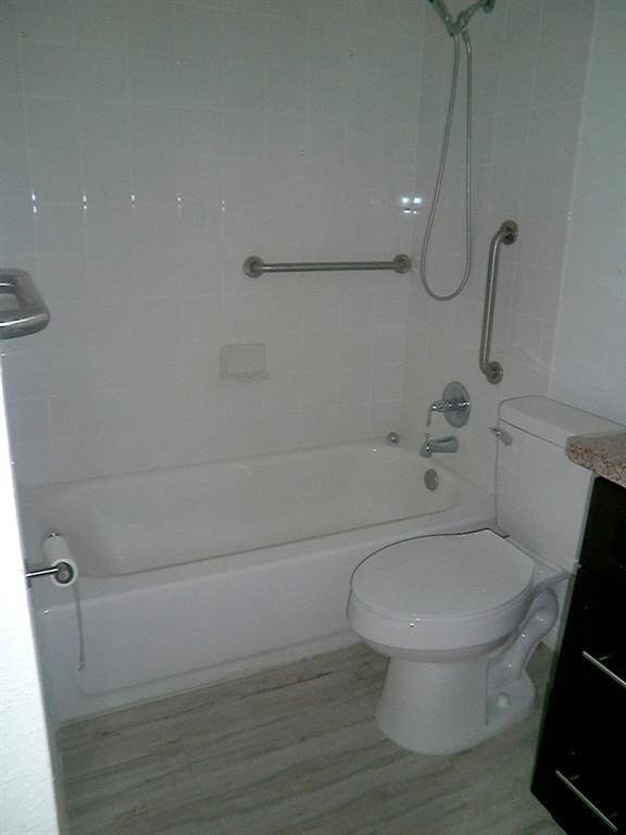 Modern bathroom with sleek, functional fixtures and a clean, inviting design.