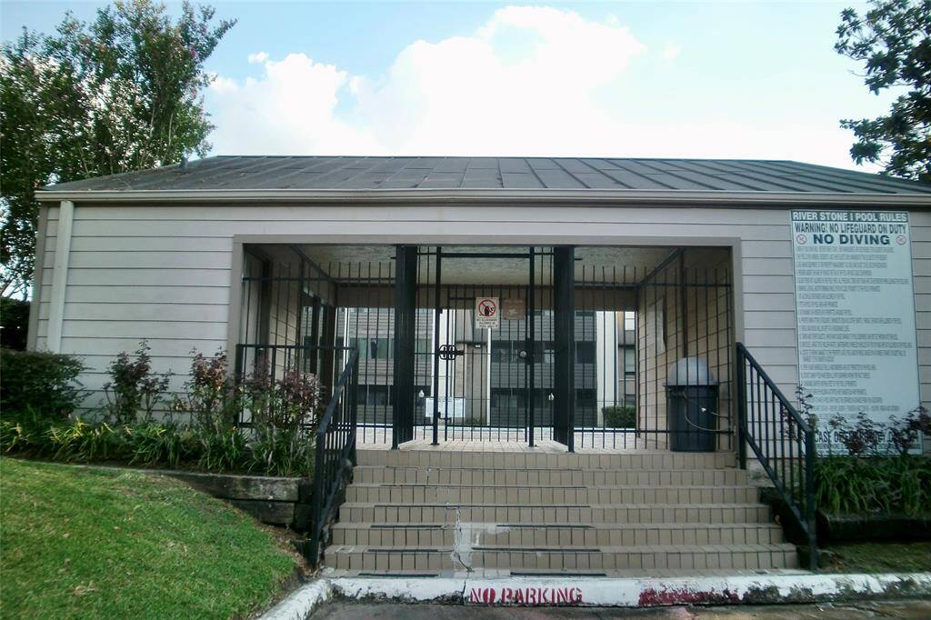 Discover the inviting entrance to the community pool, offering relaxation and fun just steps away.