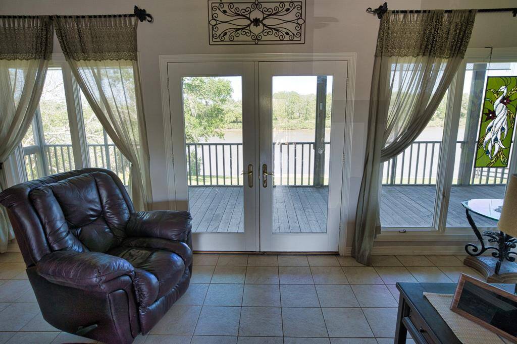 Windows all across, French doors to the Deck