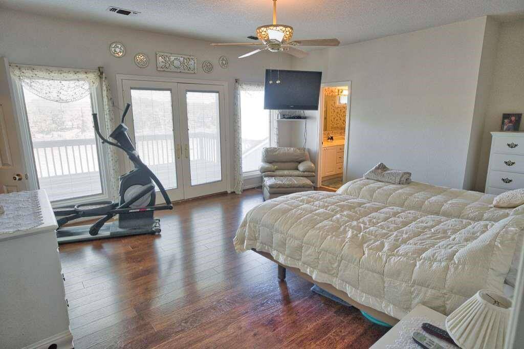 Primary Suite. 17 x 15 Room. French doors open to the Balcony