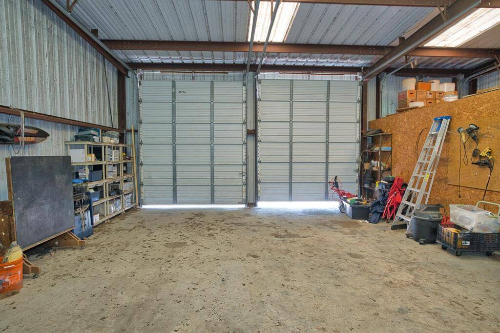 2 10' x 12' tall doors, great for Boats. Enclosed area for the well & yard equipment. Storage space above