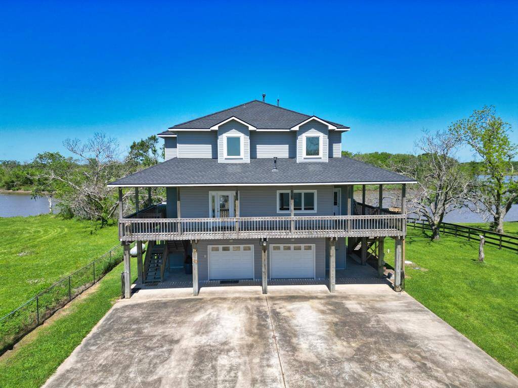 View of the home and river as you enter the property