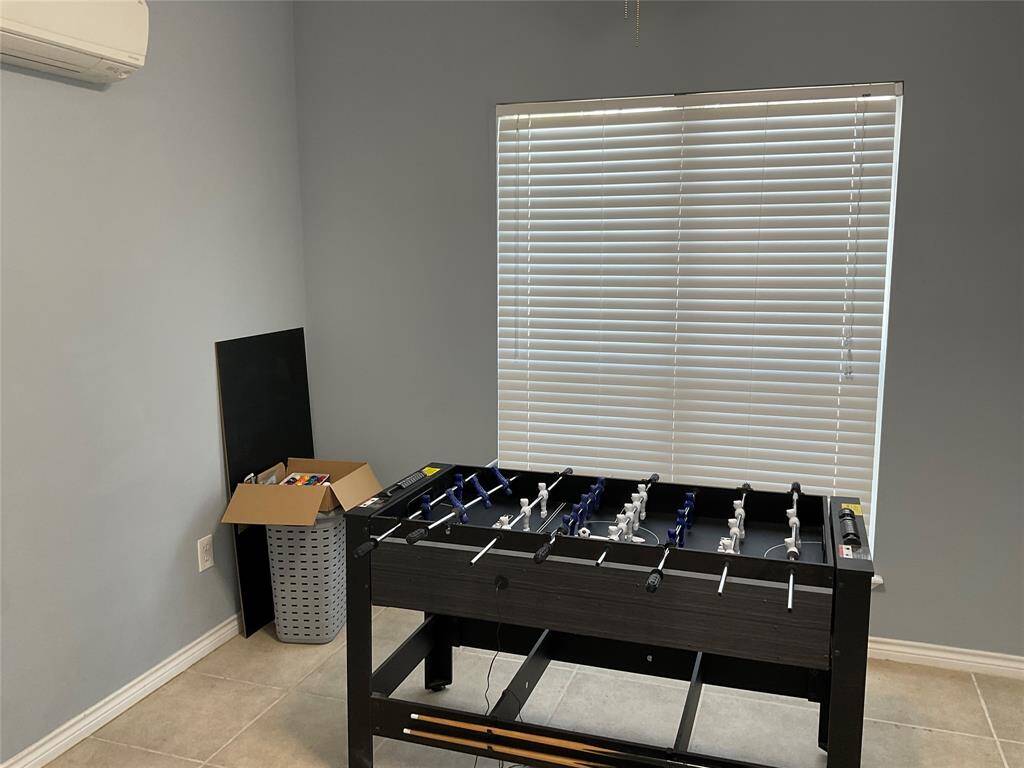 Second half of the garage apartment is currently being used as a game room.