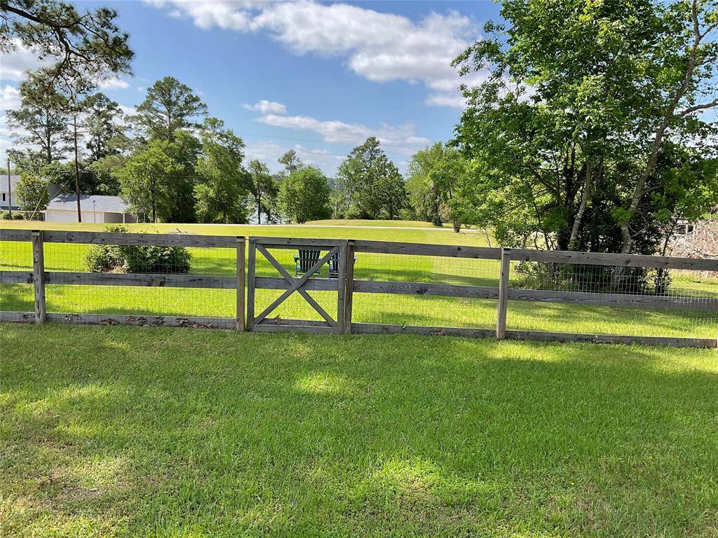 Beyond the fence is a great sitting area to enjoy the lake view.