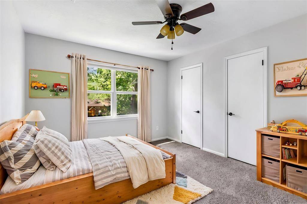 Upstairs secondary bedroom #1. This photo has been virtually staged.