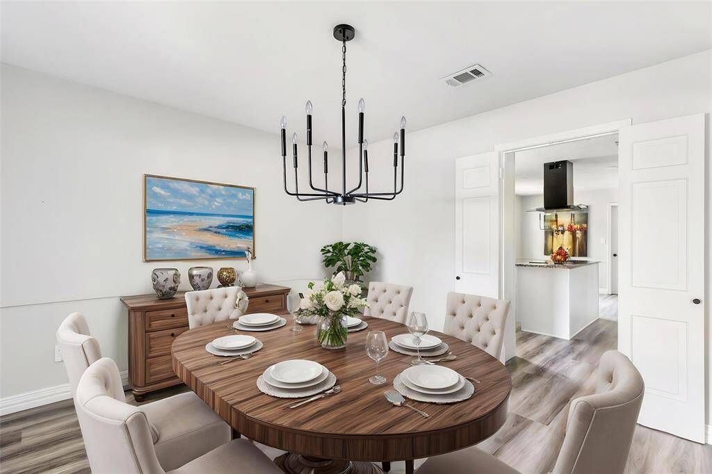 Formal dining with view into kitchen. This photo has been virtually staged.