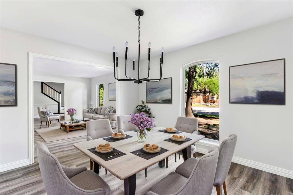 Formal dining with view into formal living and entry. This photo has been virtually staged.