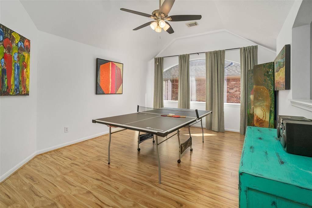 Upstairs game room with updated laminate flooring.