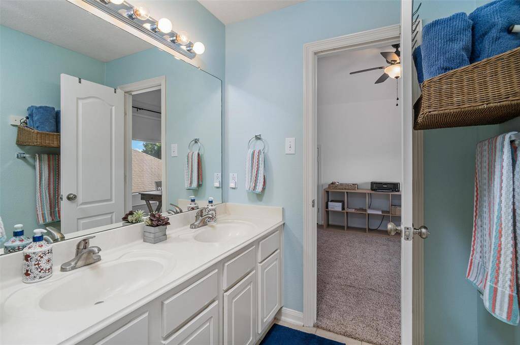 Double sinks upstairs in the full bath.