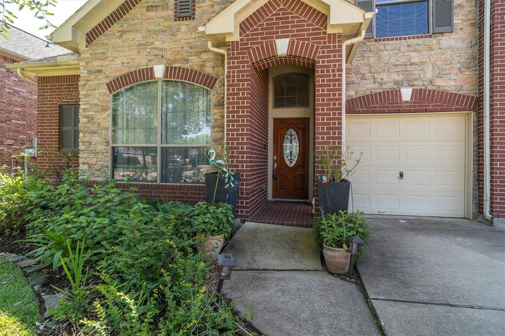 Entryway with nice landscaping.