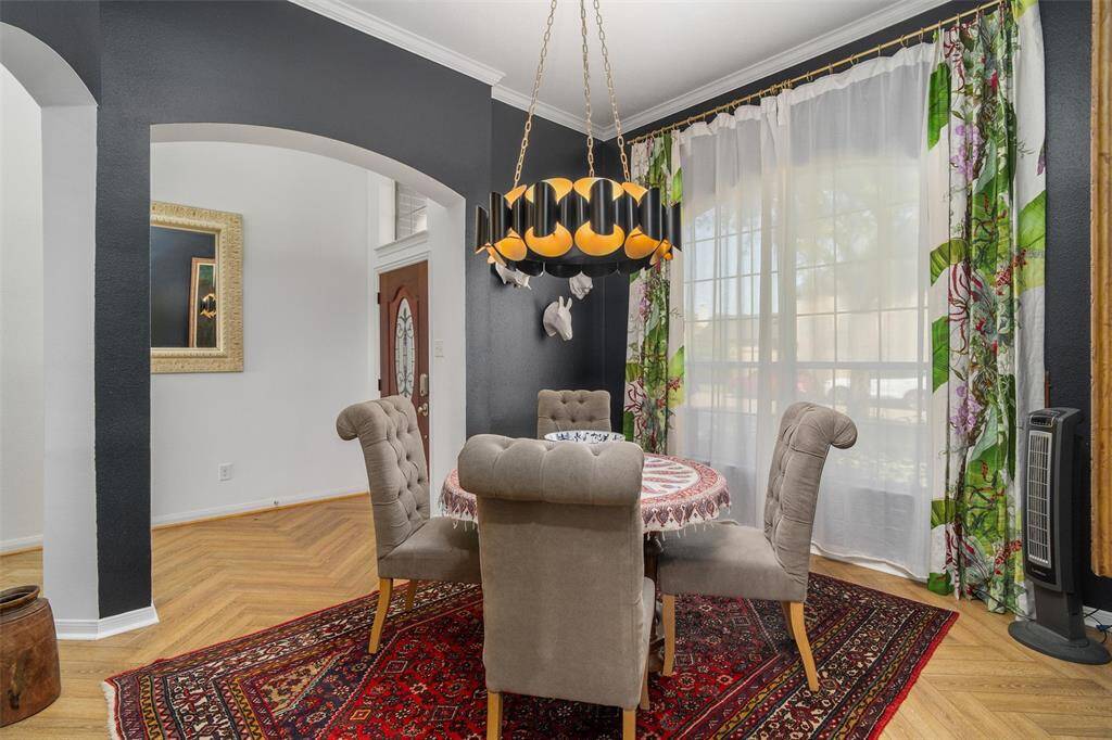 Beautifully decorated dining room. Check out that chandelier!