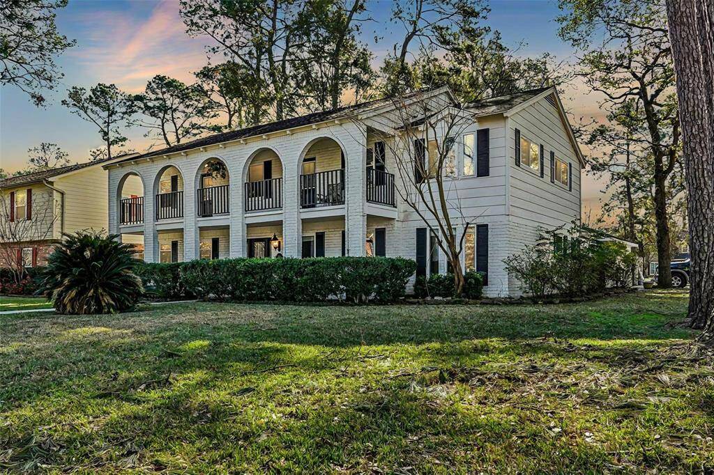 NEVER FLOODED! Spacious corner lot home in a quiet neighborhood with mature trees. Features include a balcony, double fireplace, hot tub, and upstairs den/game room.