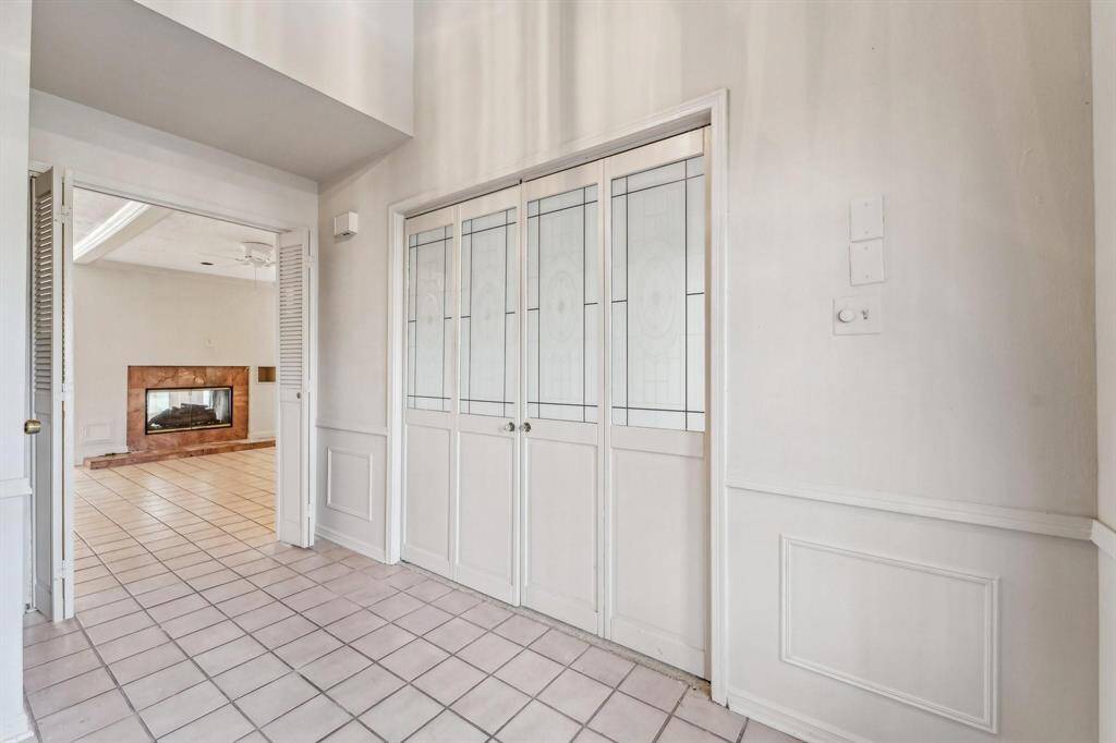 A combo dining/living room is to the right upon entering the home. It is through these beautiful doors and adjacent to the kitchen area.