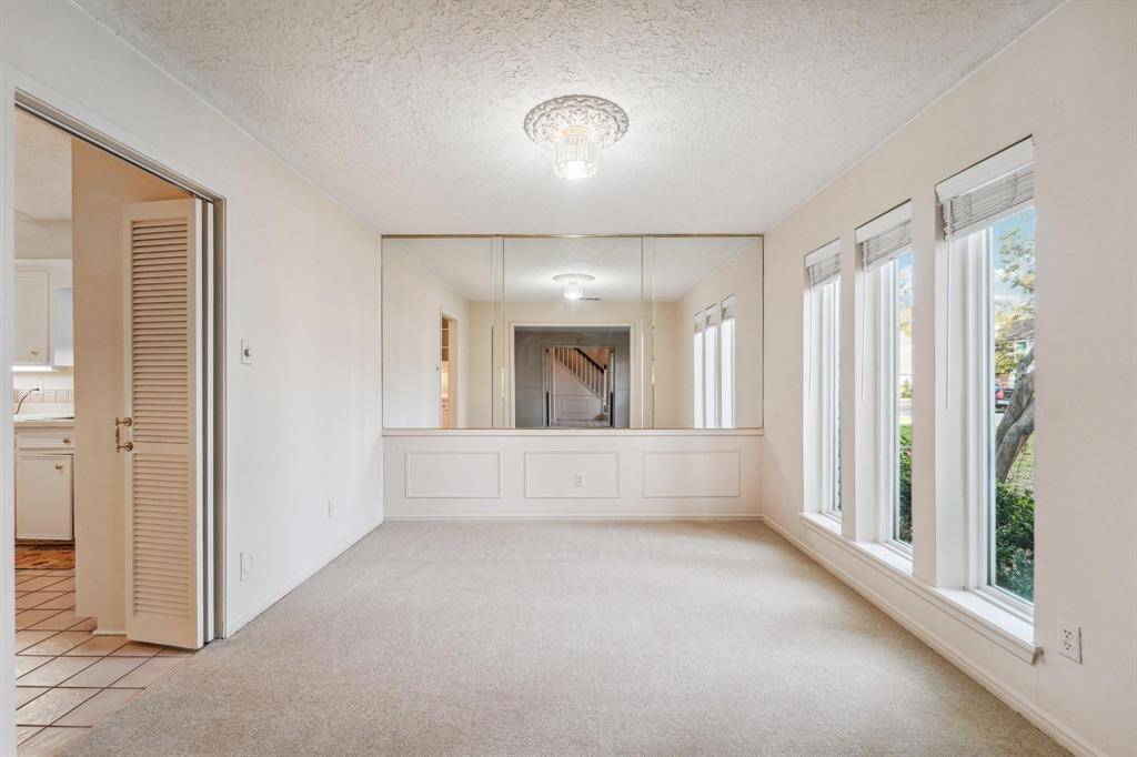 Dining room leading into the kitchen.