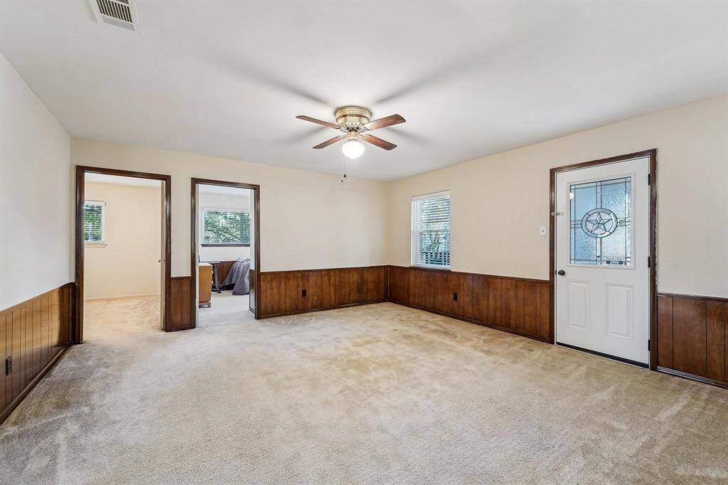 Upstairs game room with a door leading to the balcony.