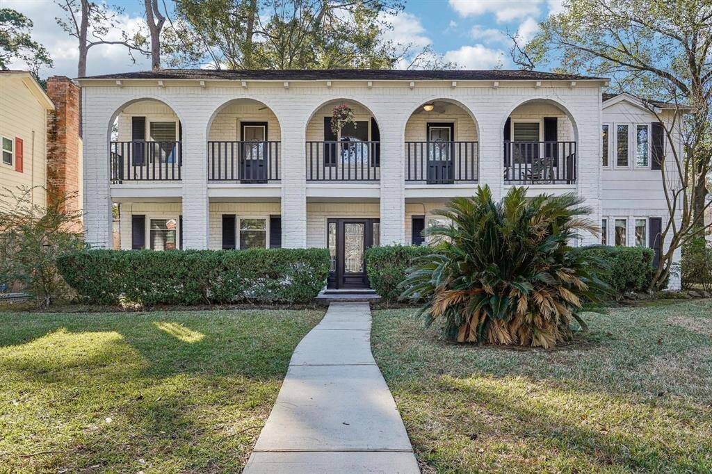 NEVER FLOODED! Spacious corner lot home in a quiet neighborhood with mature trees. Features include a balcony, double fireplace, hot tub, and upstairs den/game room.